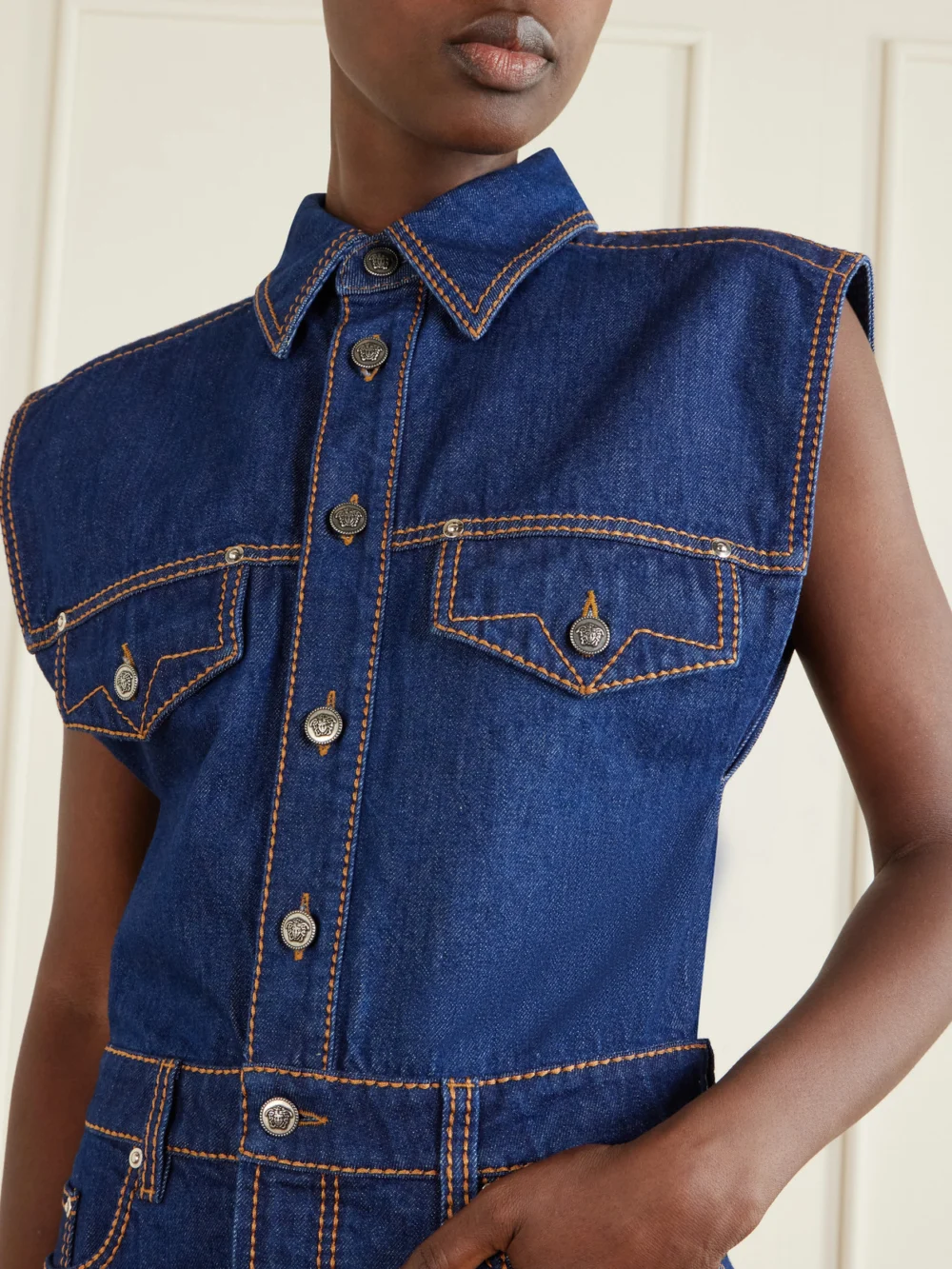 Close-up detail of the Versace Paneled Denim Mini Dress