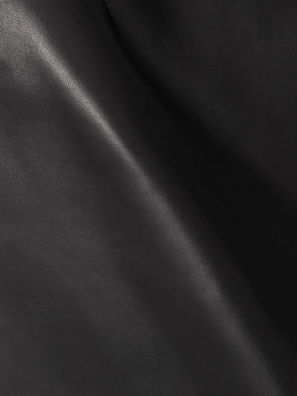 Close-up detail of the Versace Paneled Leather Mini Dress