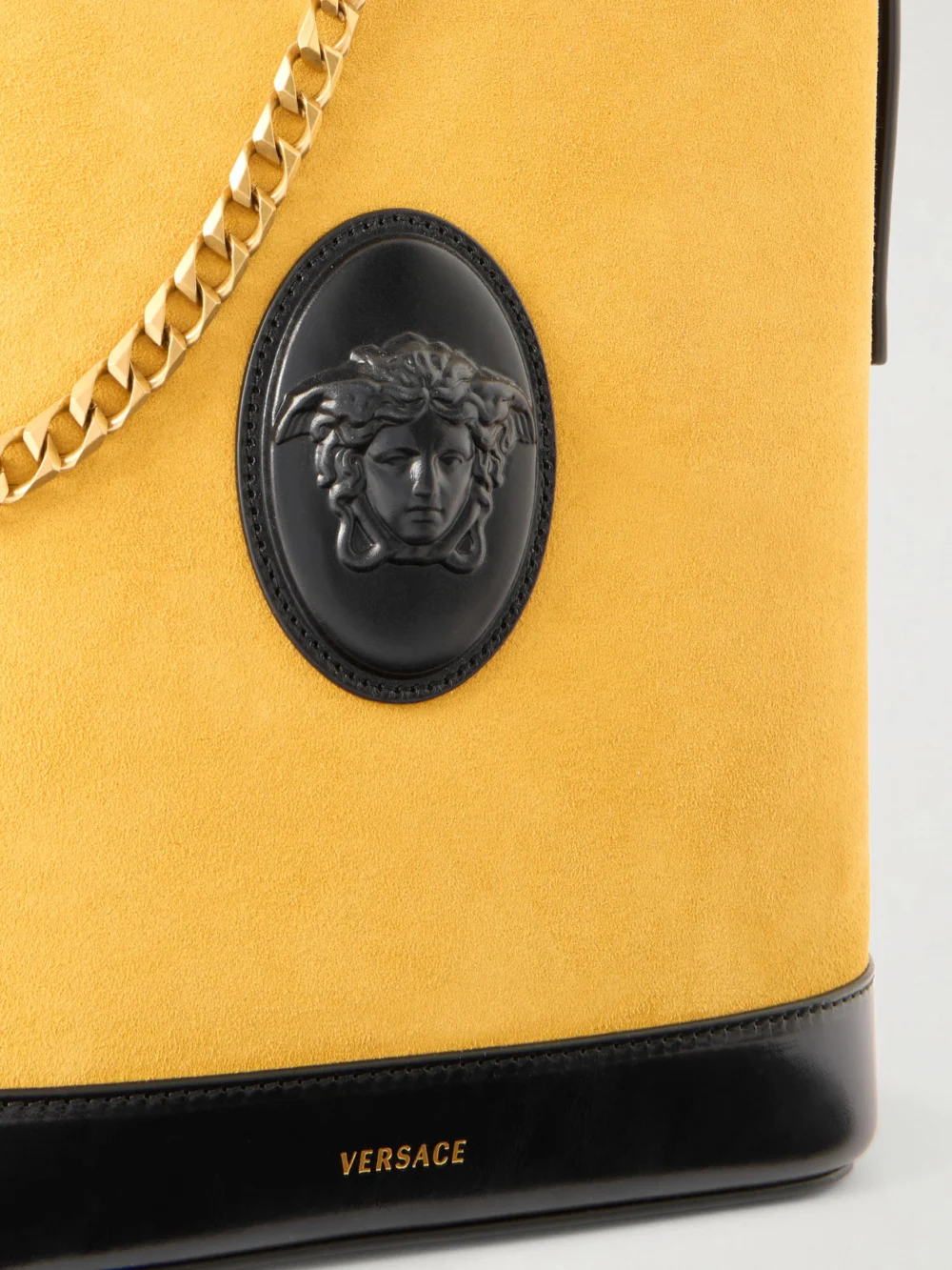 Close-up detail of the Versace Pivot Logo-appliquéd Small Leather Bucket Bag