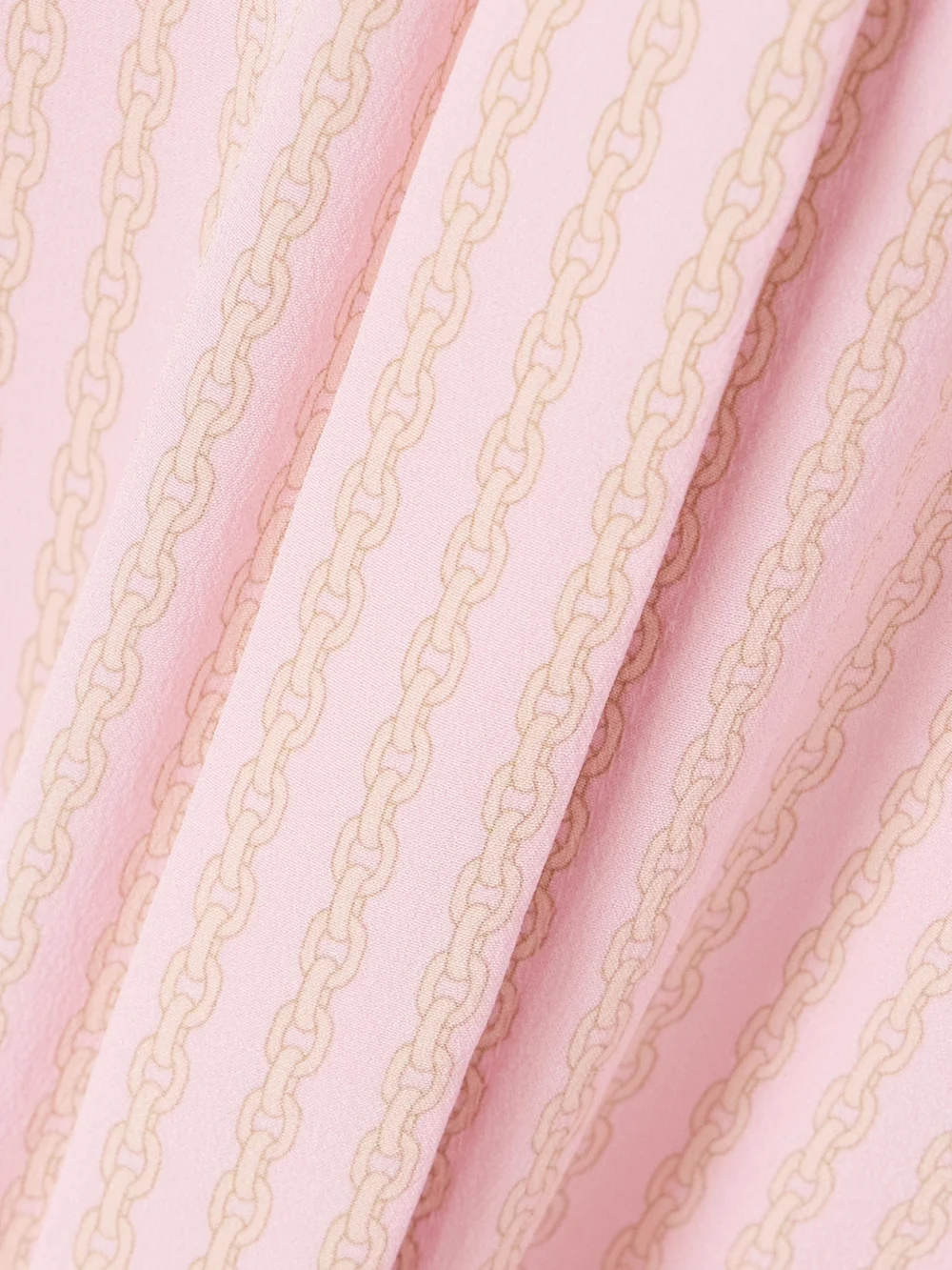 Close-up detail of the Versace Pleated Printed Silk Crepe De Chine Mini Dress