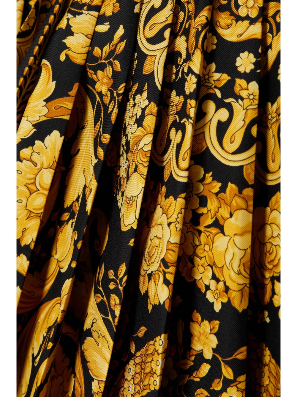 Close-up detail of the Versace Pleated Printed Silk-twill Mini Skirt