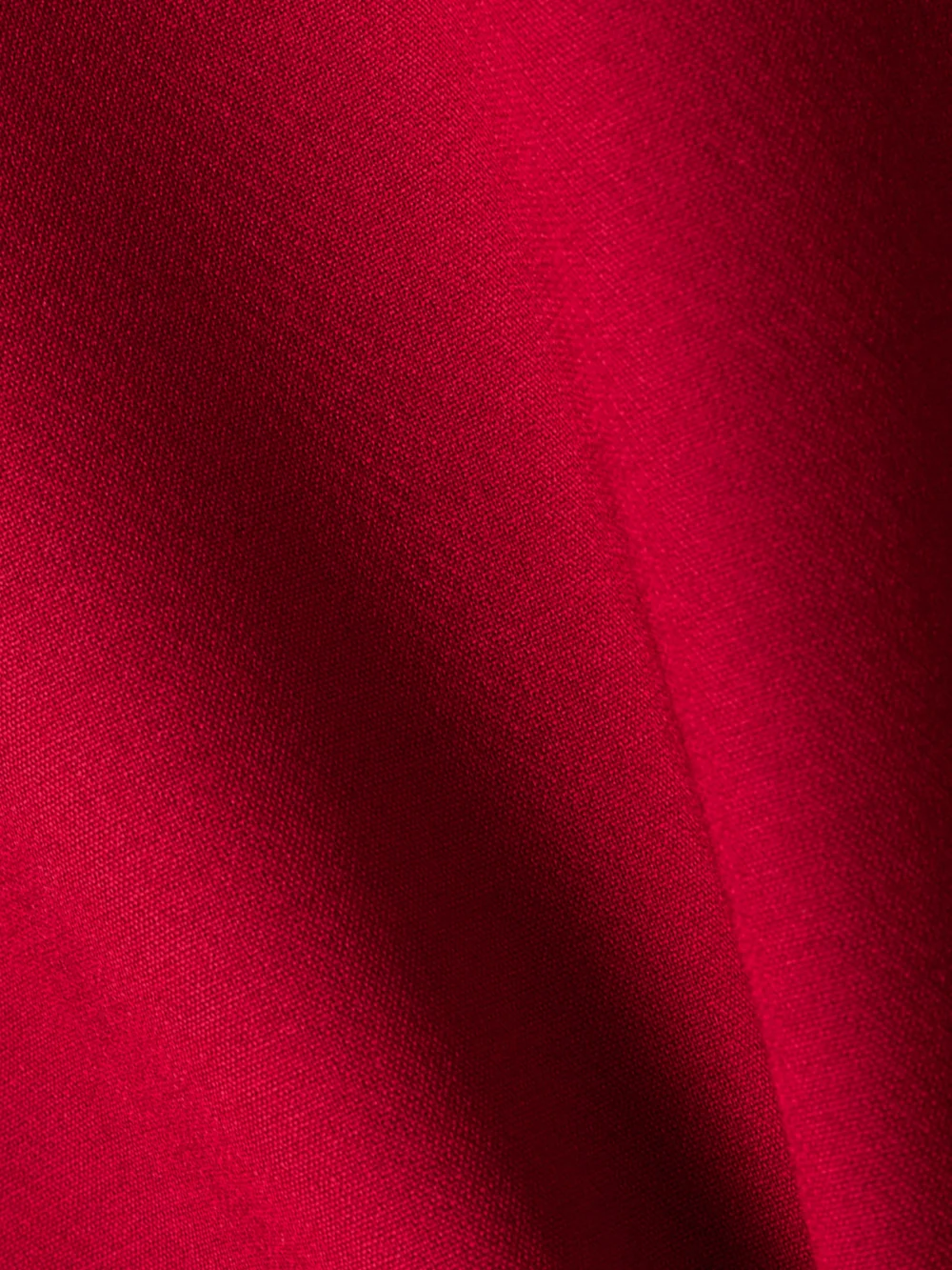 Close-up detail of the Versace Pleated Wool-blend Mini Dress