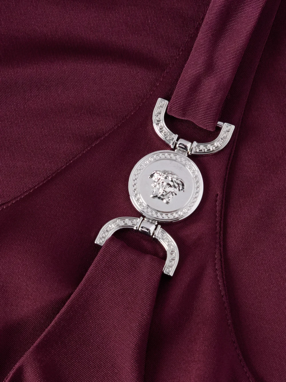 Close-up detail of the Versace Ruched Satin-jersey Midi Dress
