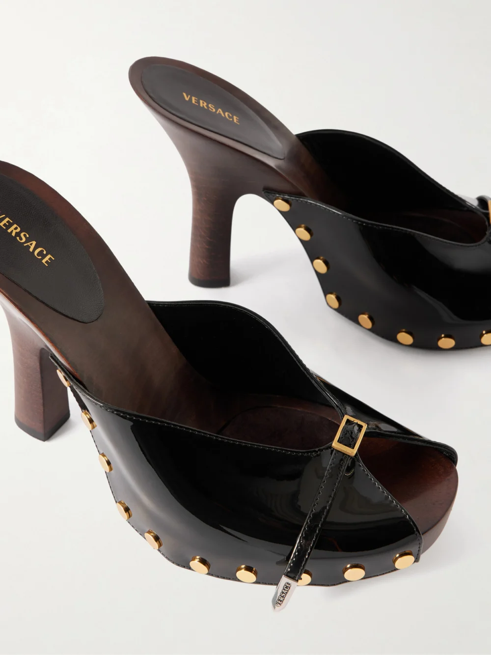 Close-up detail of the Versace Sassi 105 Patent-leather Clogs