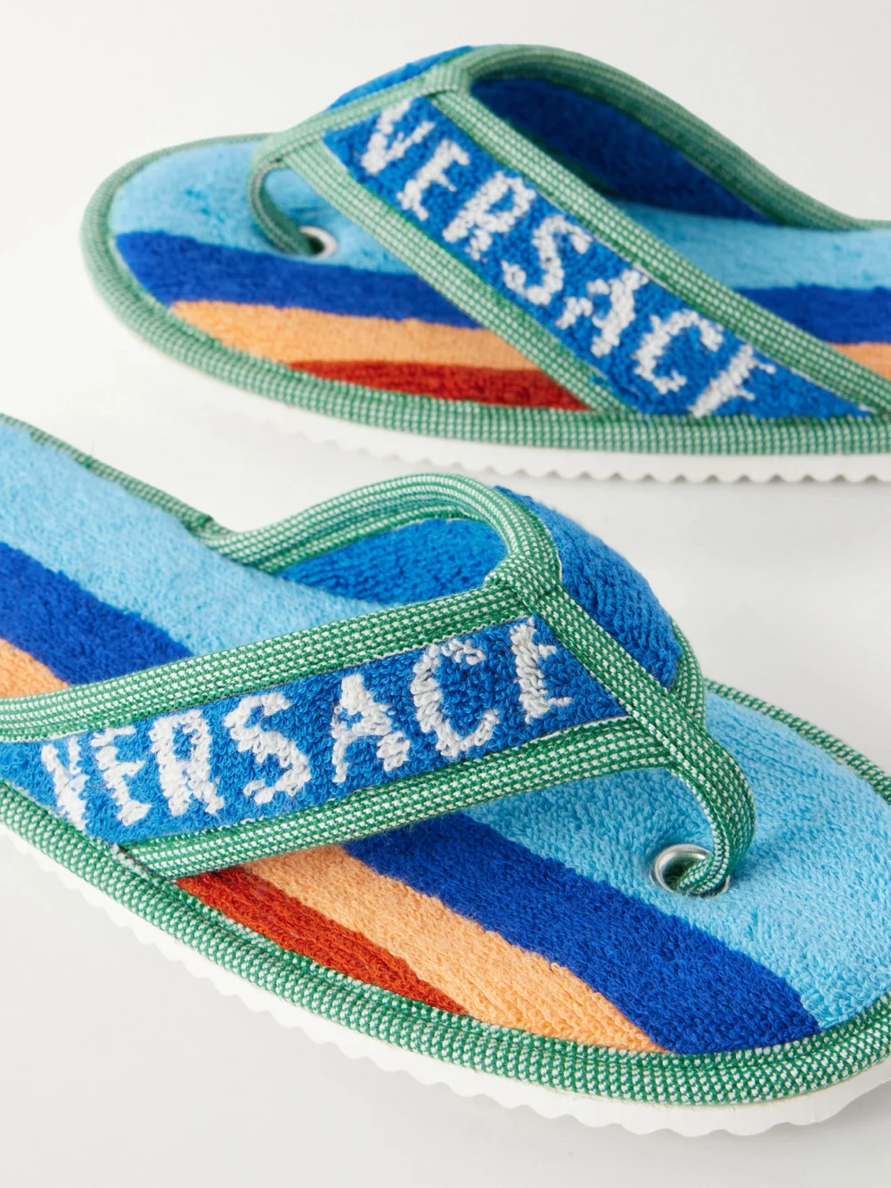 Close-up detail of the Versace Striped Cotton-terry Flip Flops
