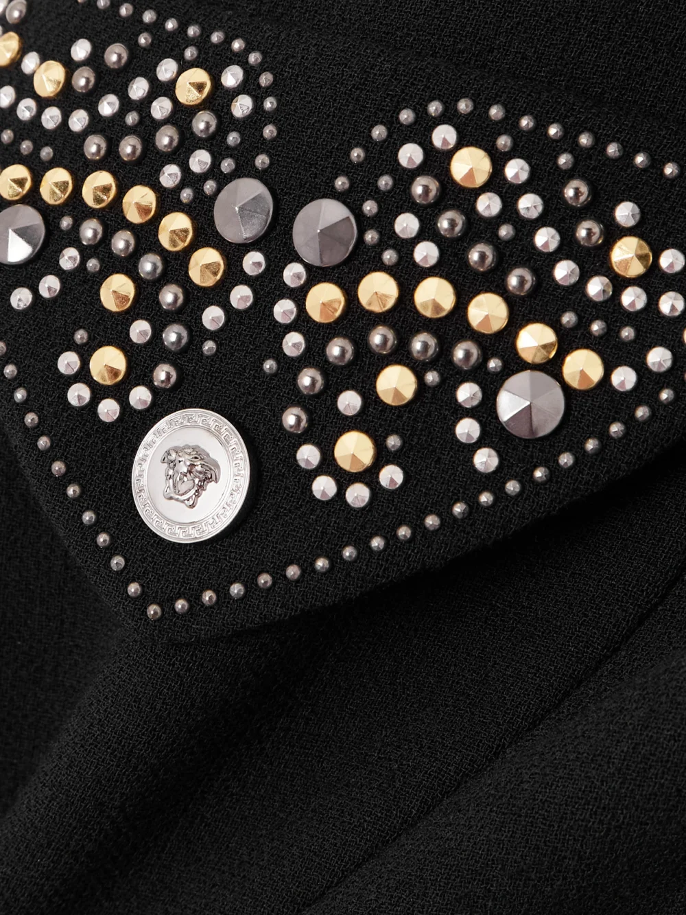 Close-up detail of the Versace Studded Wool-crepe Midi Skirt