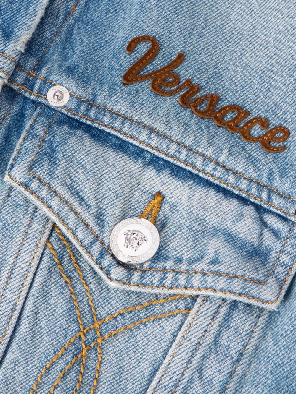 Close-up detail of the Versace Suede-trimmed Denim Jacket