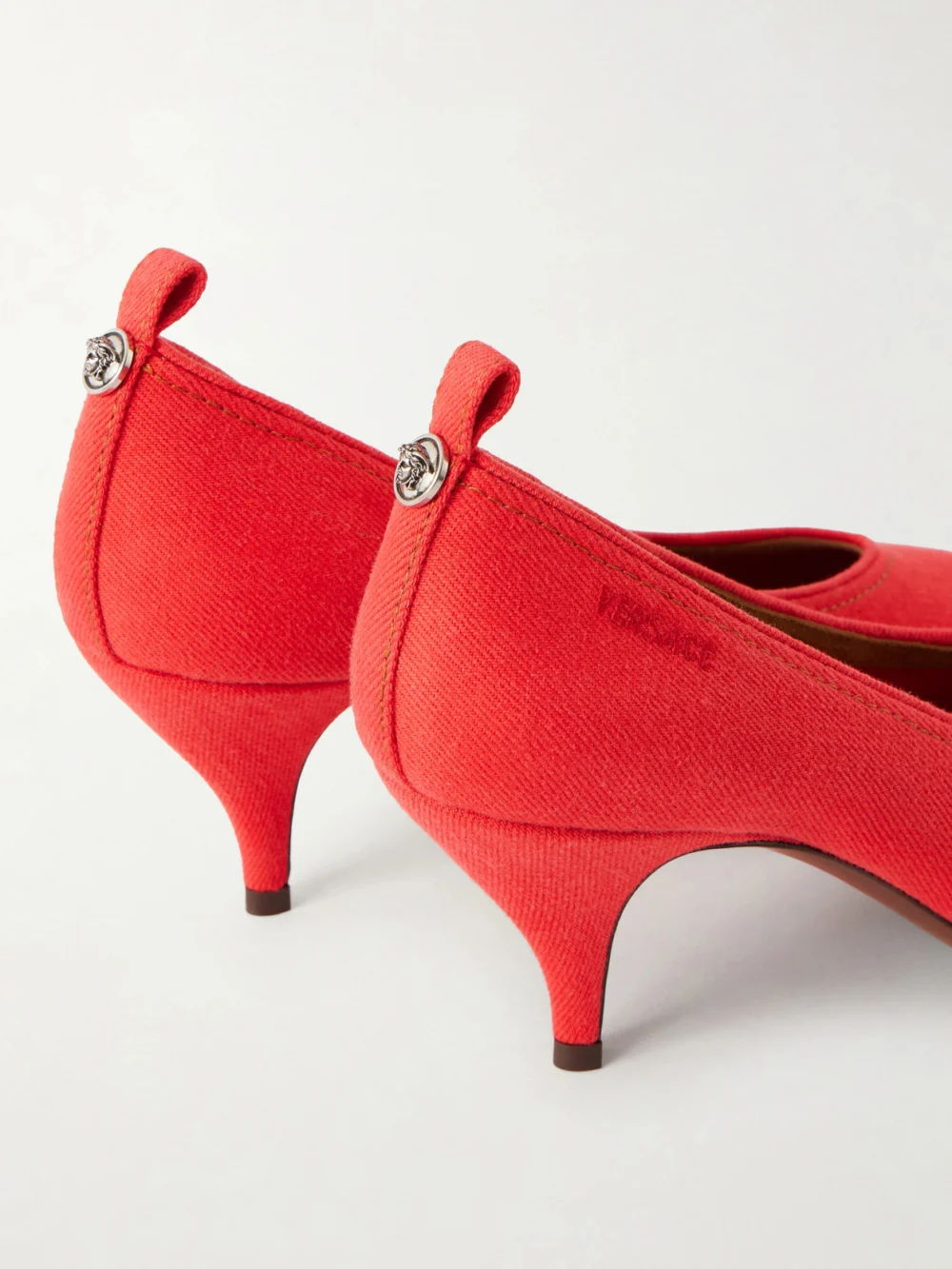 Close-up detail of the Versace Tina 65 Denim Pumps