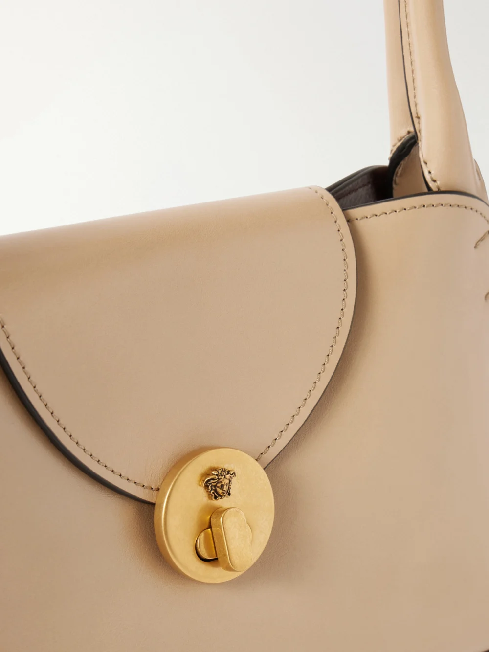 Close-up detail of the Versace Vivian Medusa-embellished Leather Shoulder Bag