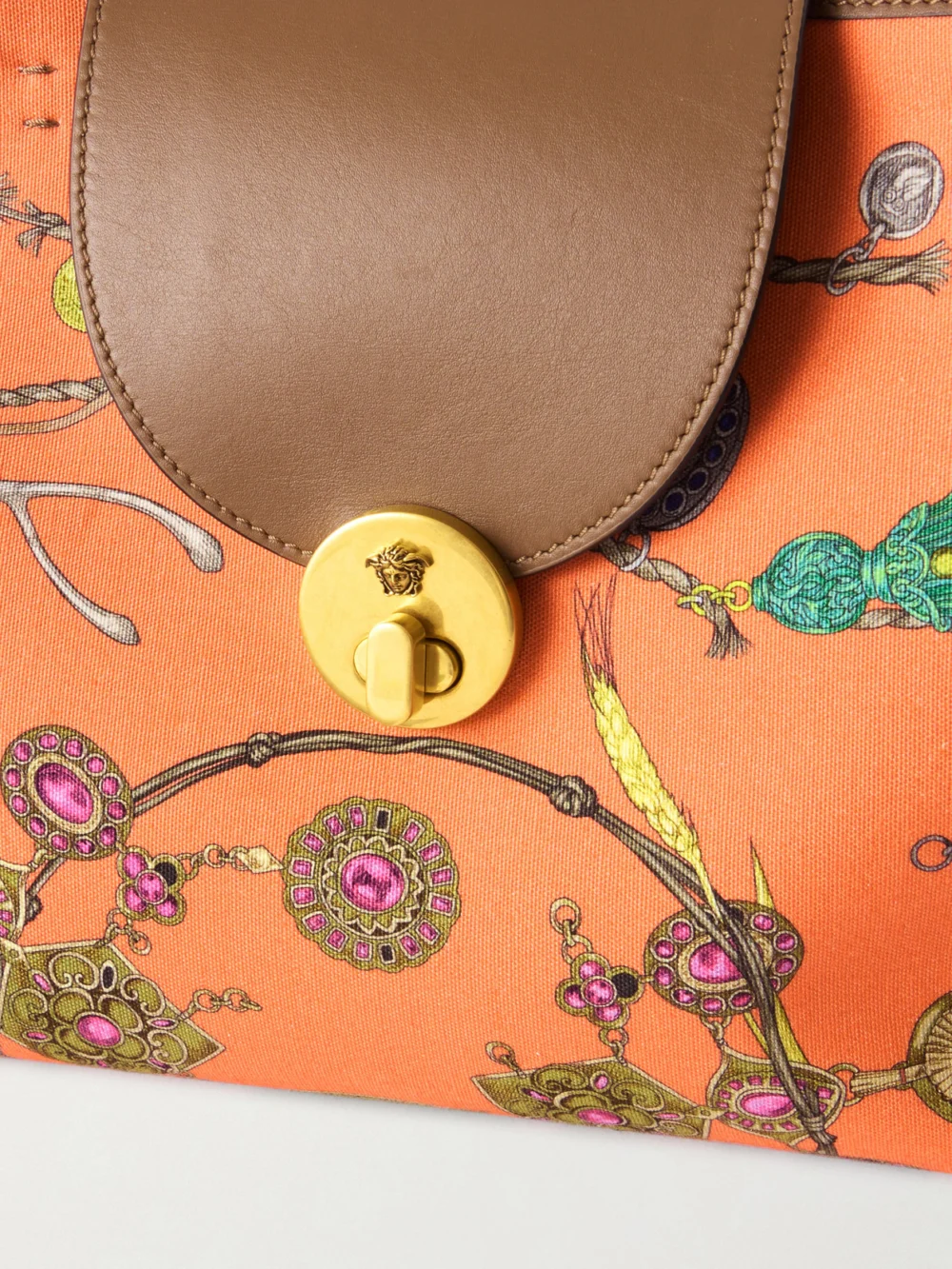 Close-up detail of the Versace Vivian Printed Leather-trimmed Canvas Tote