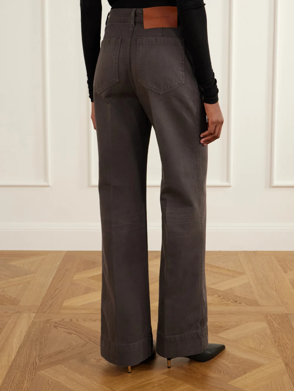 Back view of the Victoria Beckham Alina High-rise Flared Jeans