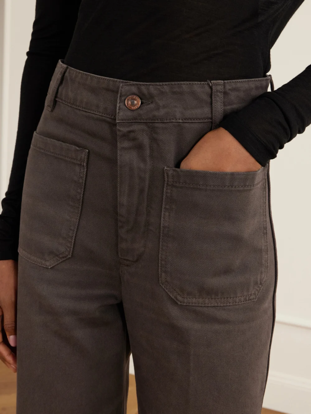 Close-up detail of the Victoria Beckham Alina High-rise Flared Jeans