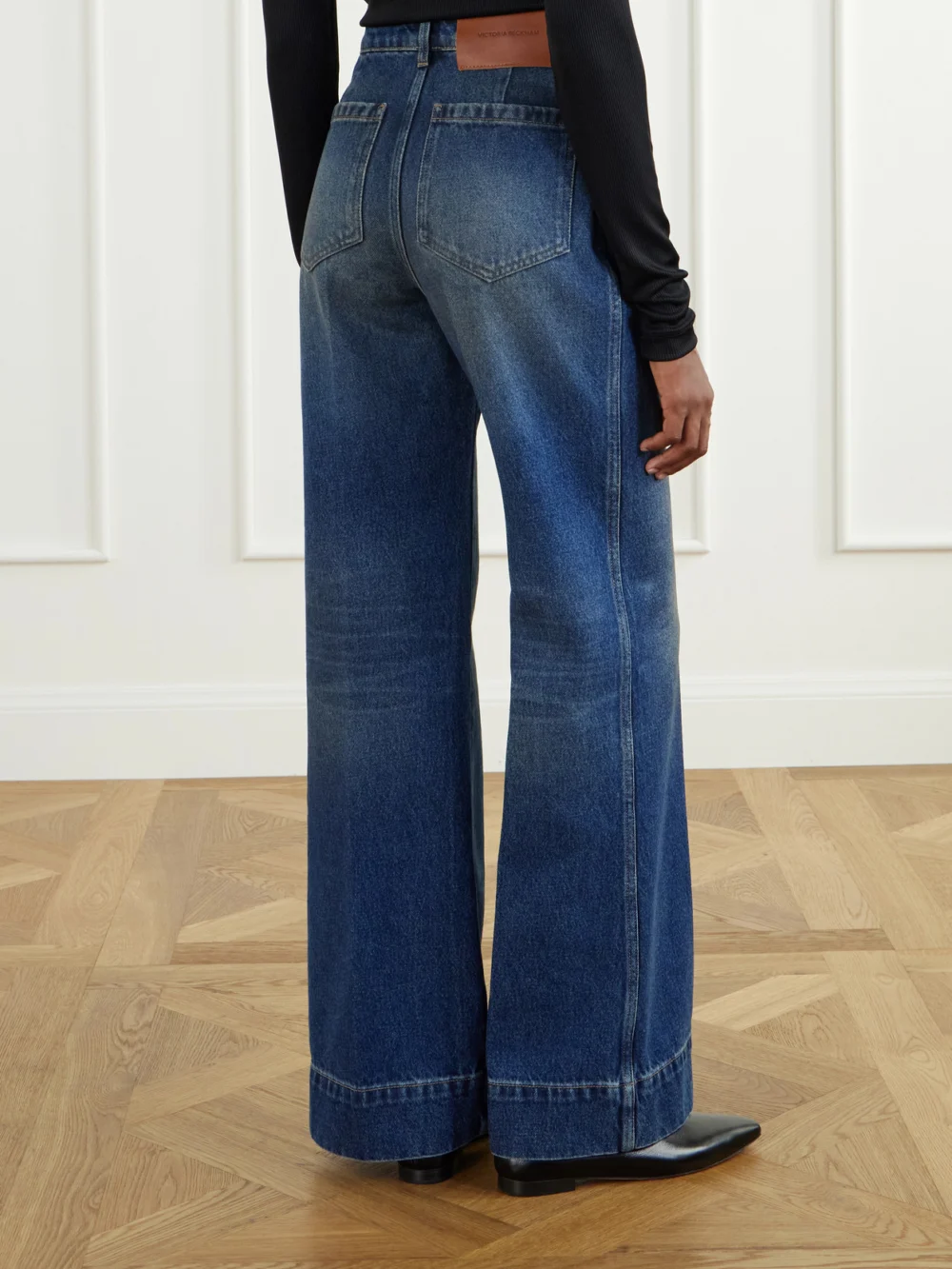 Back view of the Victoria Beckham Alina High-rise Flared Jeans
