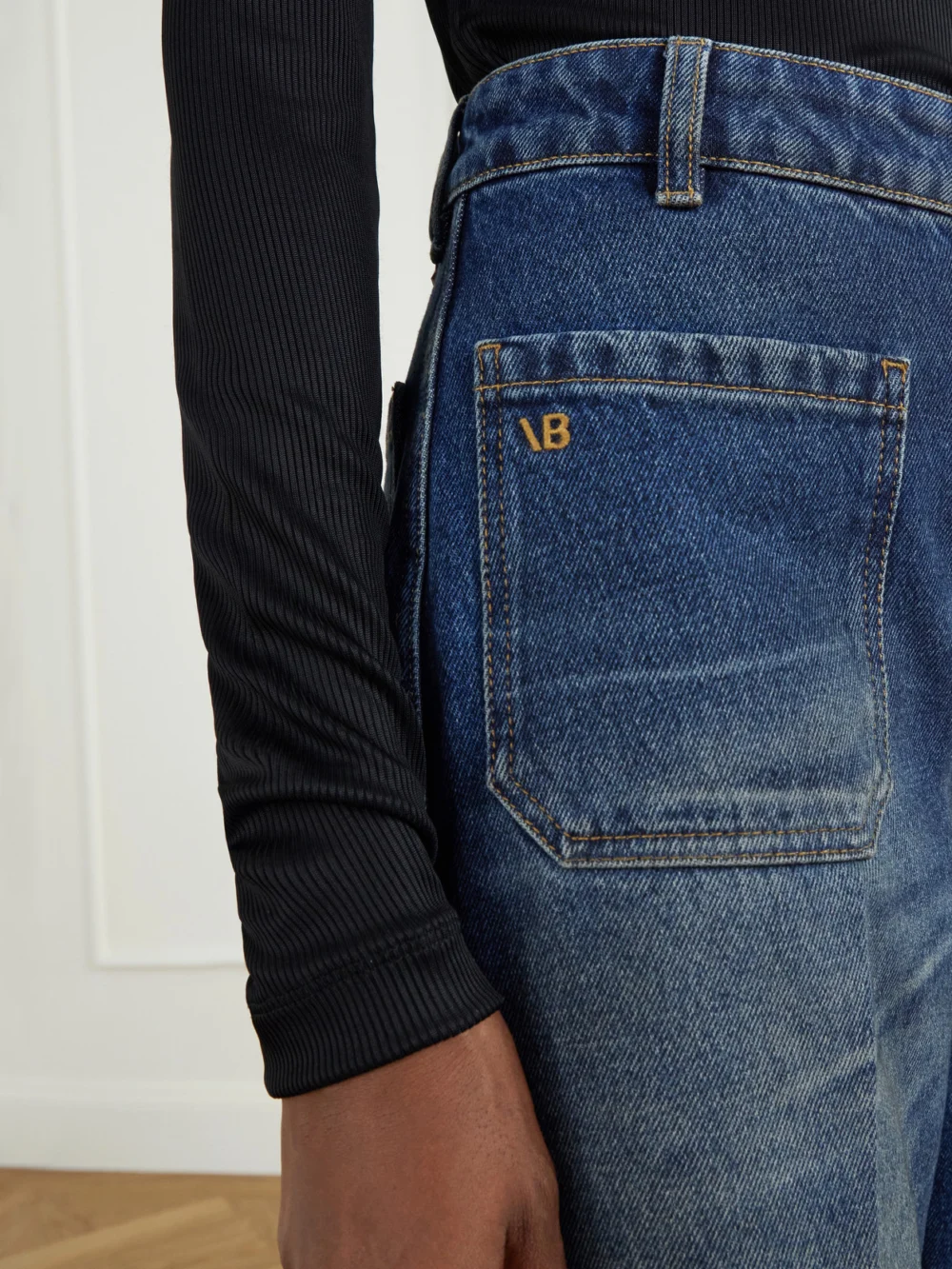 Close-up detail of the Victoria Beckham Alina High-rise Flared Jeans