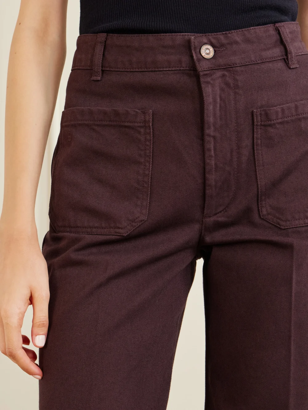 Close-up detail of the Victoria Beckham Alina High-rise Wide-leg Jeans