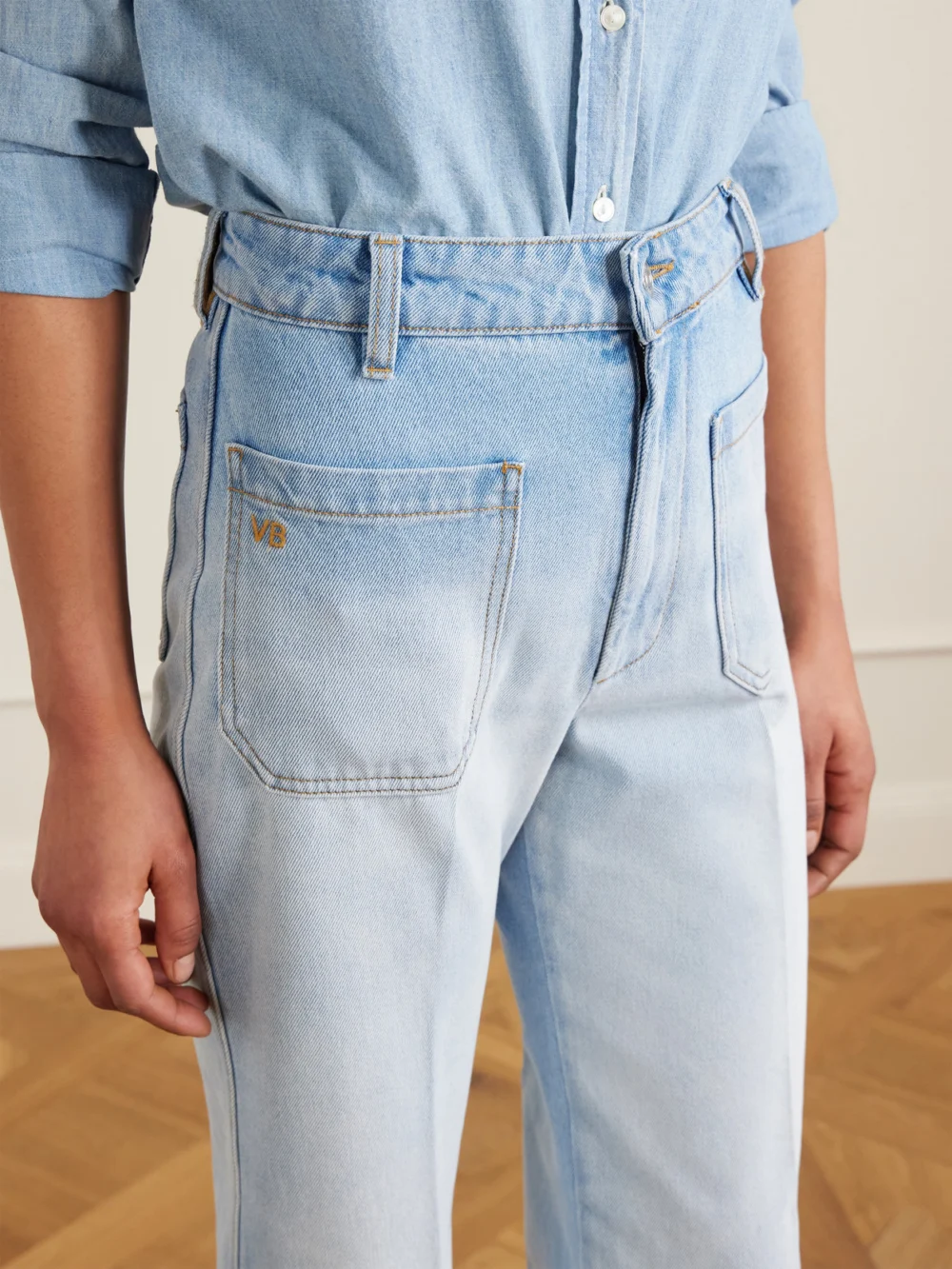 Close-up detail of the Victoria Beckham Alina High-rise Wide-leg Jeans