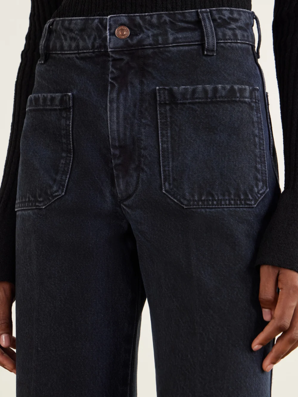Close-up detail of the Victoria Beckham Alina Logo-embroidered High-rise Flared Jeans