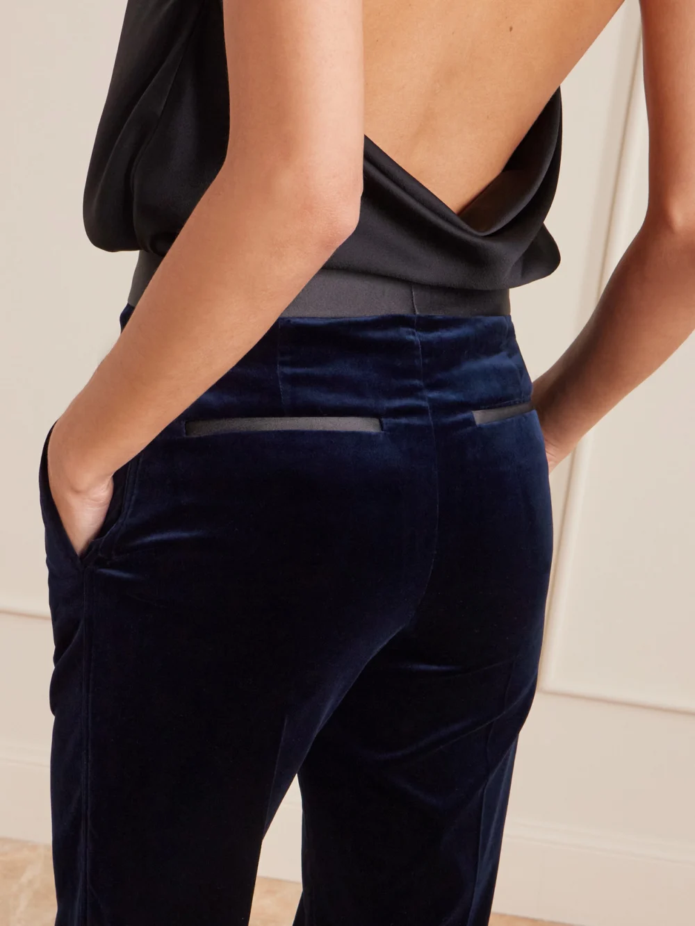 Close-up detail of the Victoria Beckham Alina Satin-trimmed Cotton-blend Velvet Wide-leg Pants