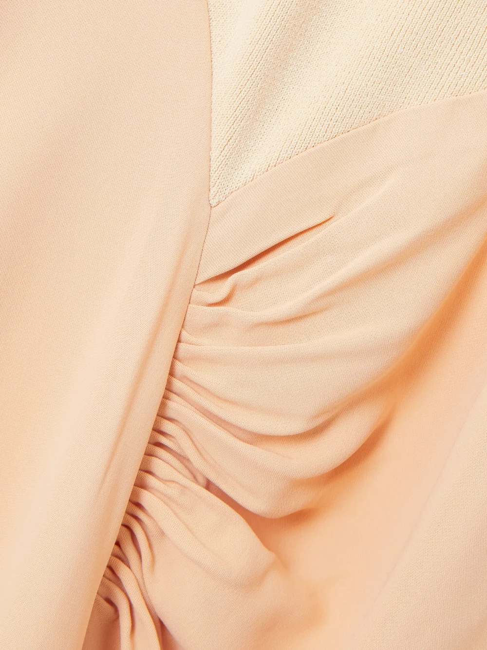 Close-up detail of the Victoria Beckham Asymmetric Draped Gathered Ribbed-knit and Crepe Midi Dress
