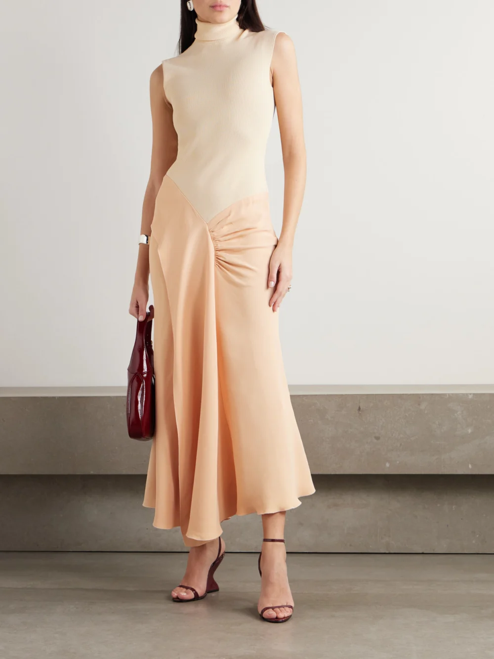 Victoria Beckham Asymmetric Draped Gathered Ribbed-knit and Crepe Midi Dress, worn by a model