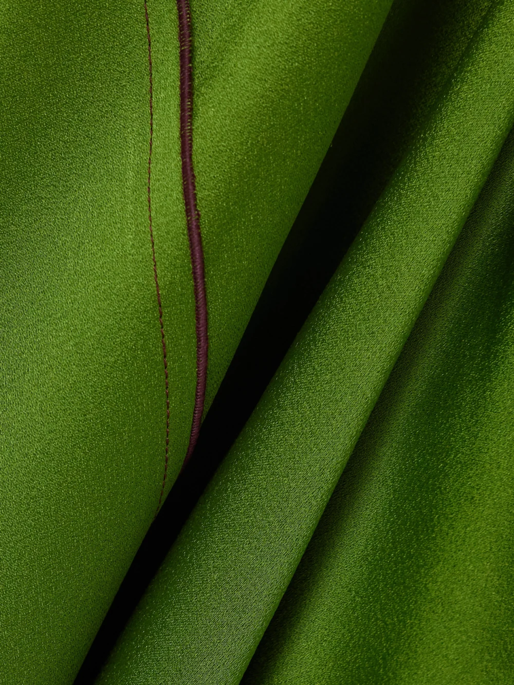 Close-up detail of the Victoria Beckham Asymmetric Draped Satin Midi Dress