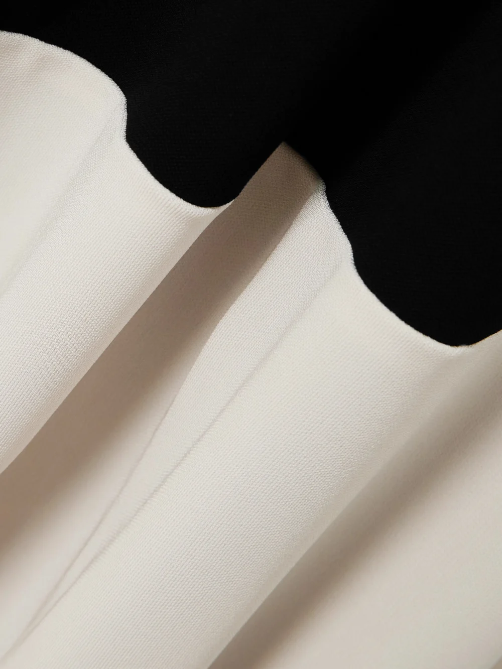 Close-up detail of the Victoria Beckham Asymmetric Two-tone Gathered Stretch-jersey Midi Dress