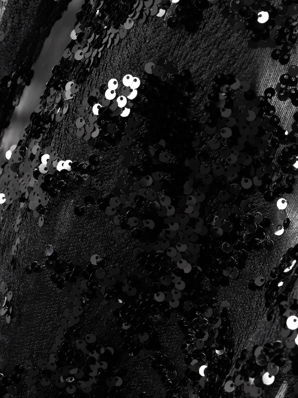 Close-up detail of the Victoria Beckham Backless Sequined Tulle Gown