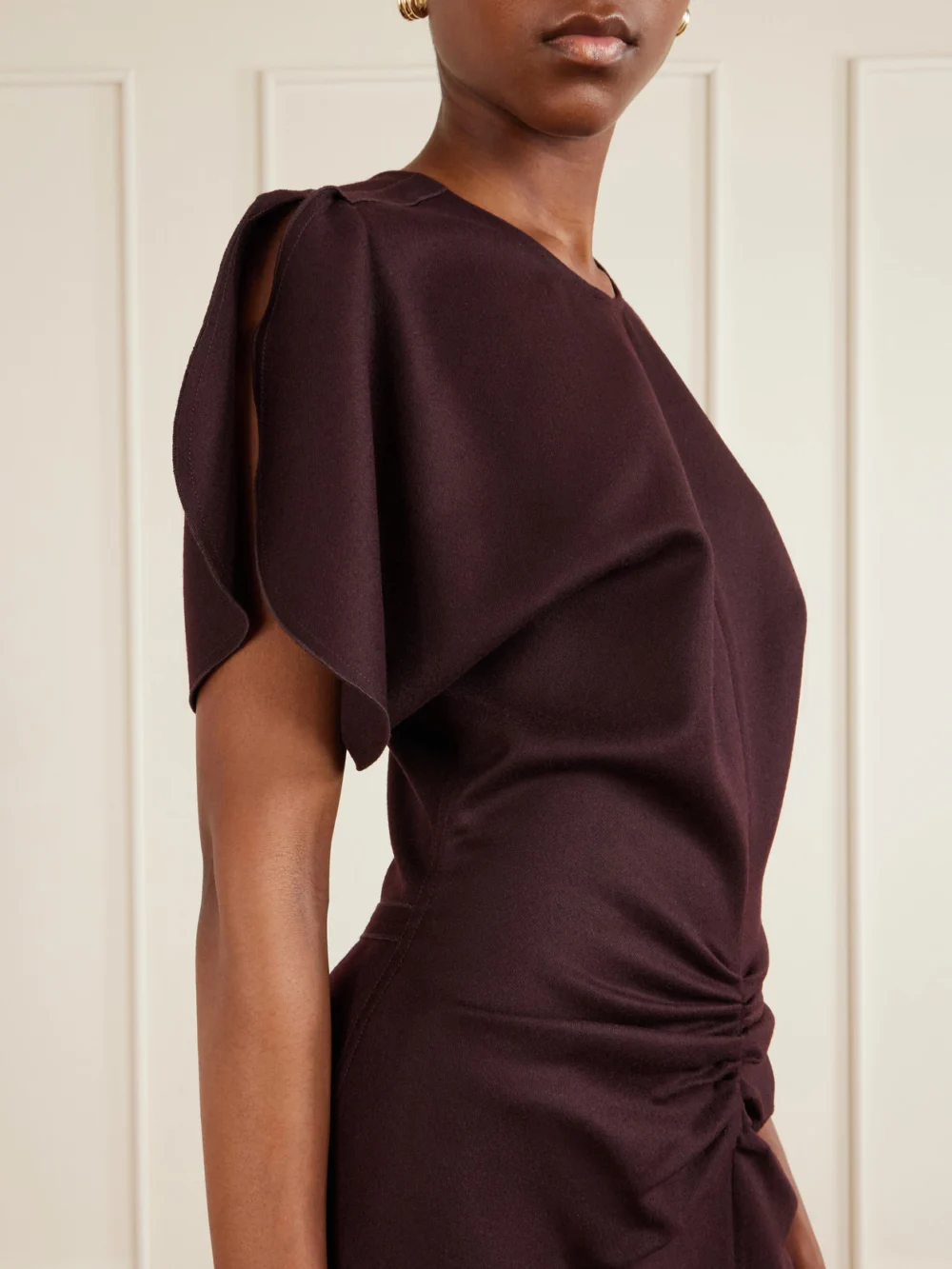 Close-up detail of the Victoria Beckham Bela Draped Wool Midi Dress