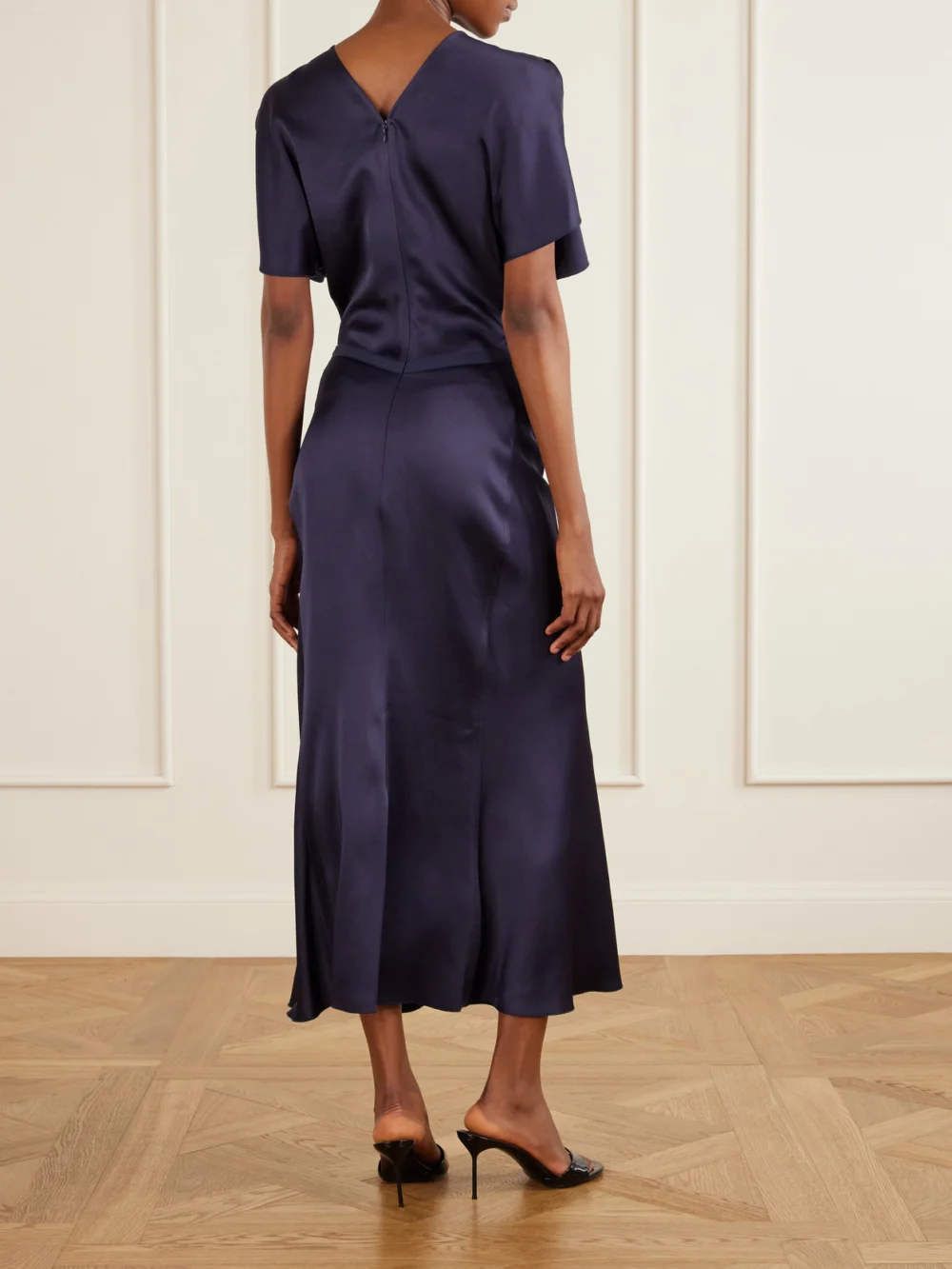 Back view of the Victoria Beckham Bela Gathered Satin Midi Dress