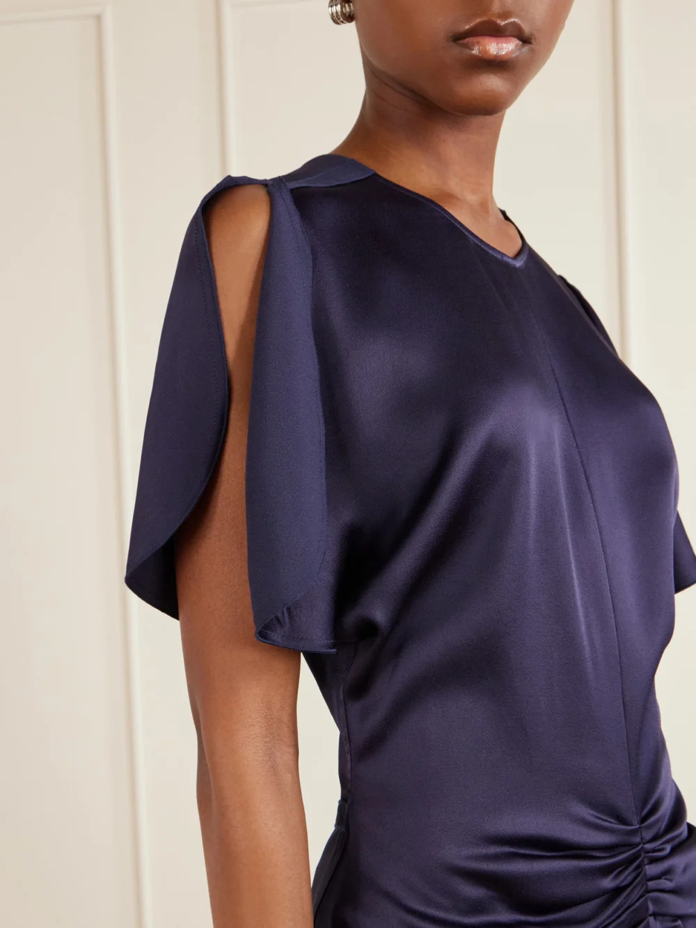 Close-up detail of the Victoria Beckham Bela Gathered Satin Midi Dress