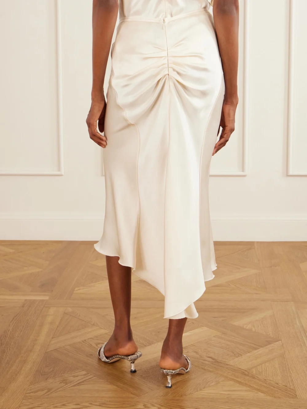 Back view of the Victoria Beckham Bela Ruched Satin Midi Skirt