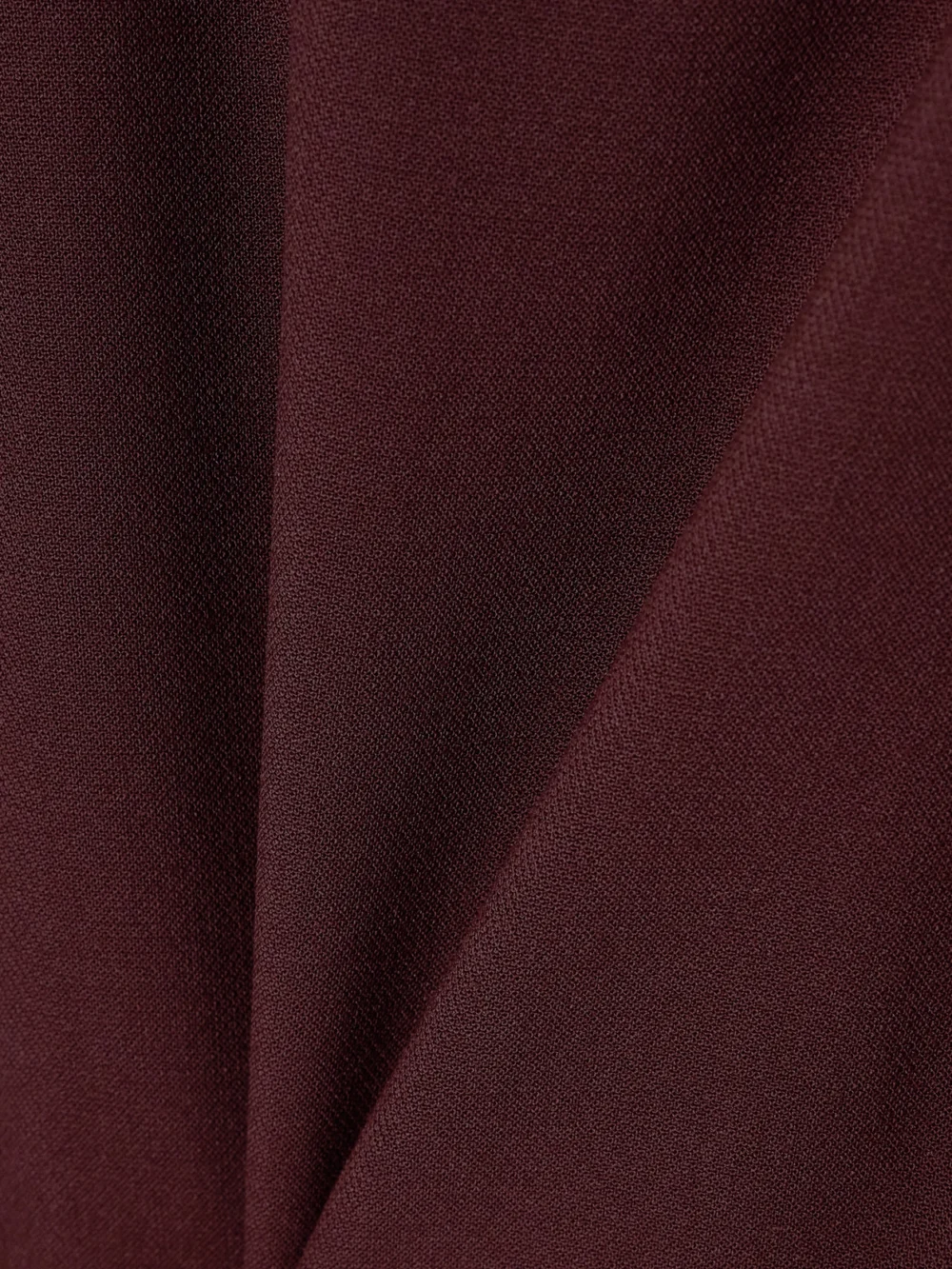 Close-up detail of the Victoria Beckham Crepe Dress