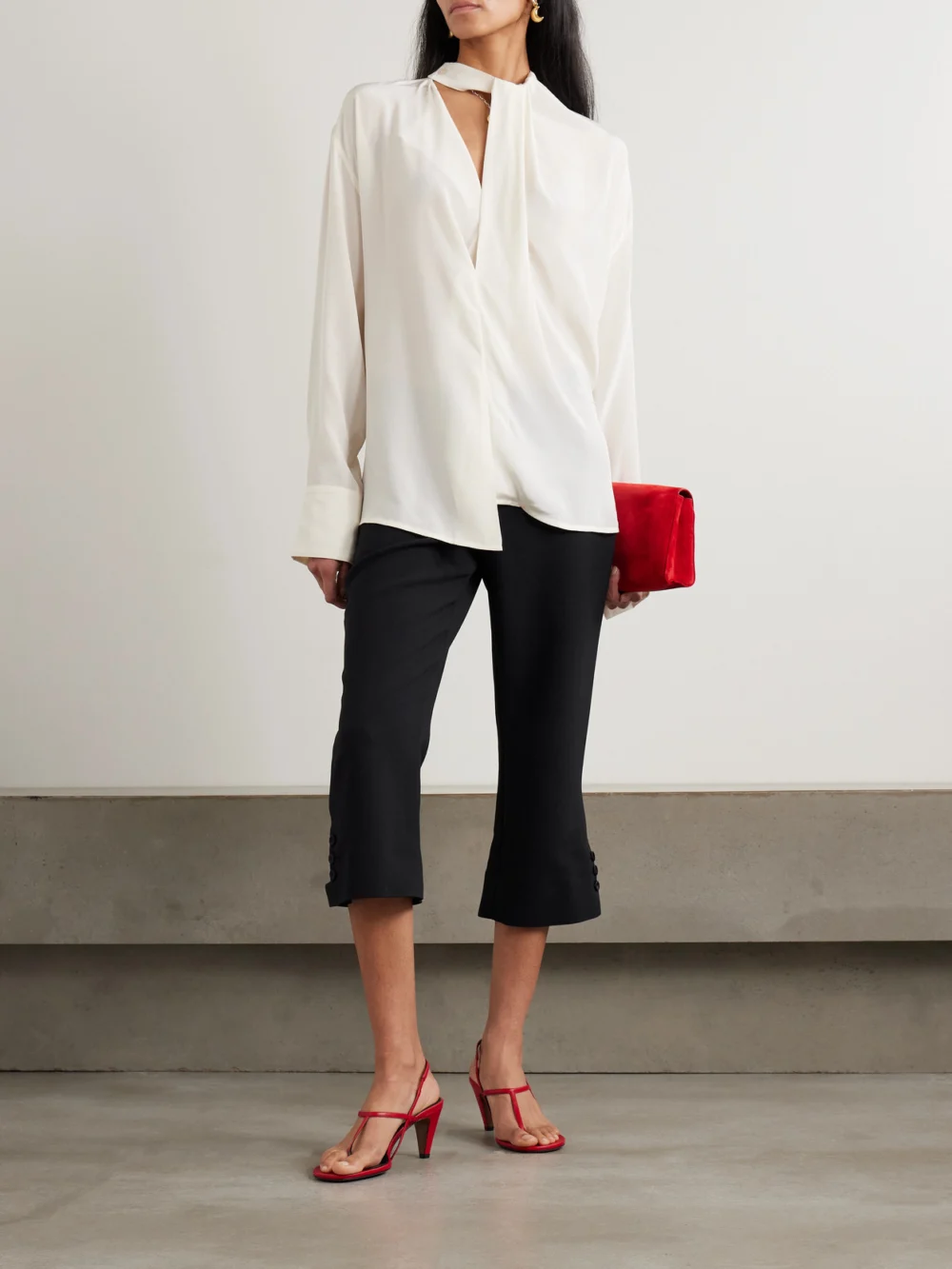 Victoria Beckham Cropped Crepe Flared Pants, worn by a model