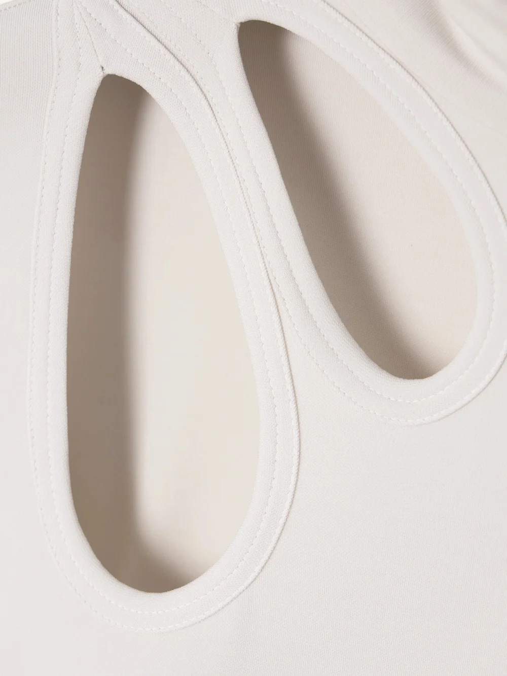 Close-up detail of the Victoria Beckham Cutout Asymmetric Stretch-jersey Turtleneck Midi Dress