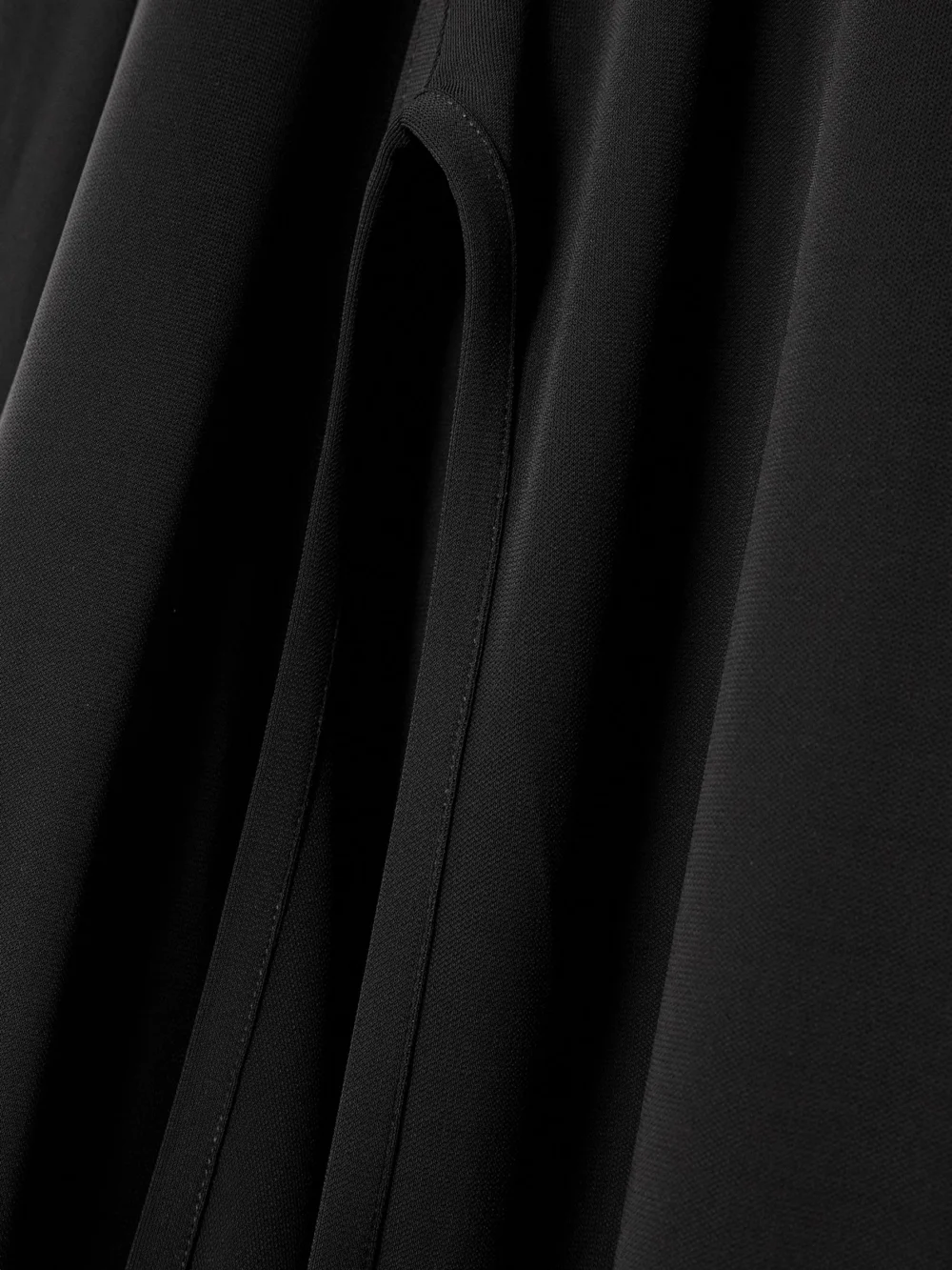 Close-up detail of the Victoria Beckham Cutout Stretch-jersey Maxi Dress