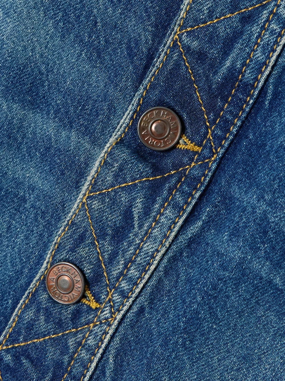 Close-up detail of the Victoria Beckham Denim Midi Skirt