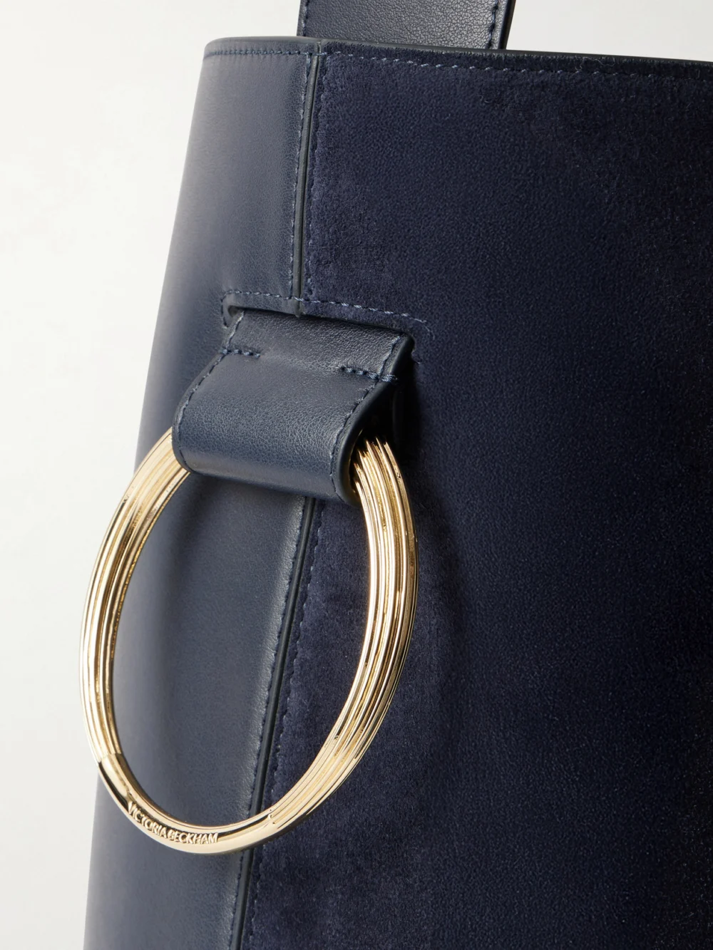 Close-up detail of the Victoria Beckham Dia Leather and Suede Bucket Bag