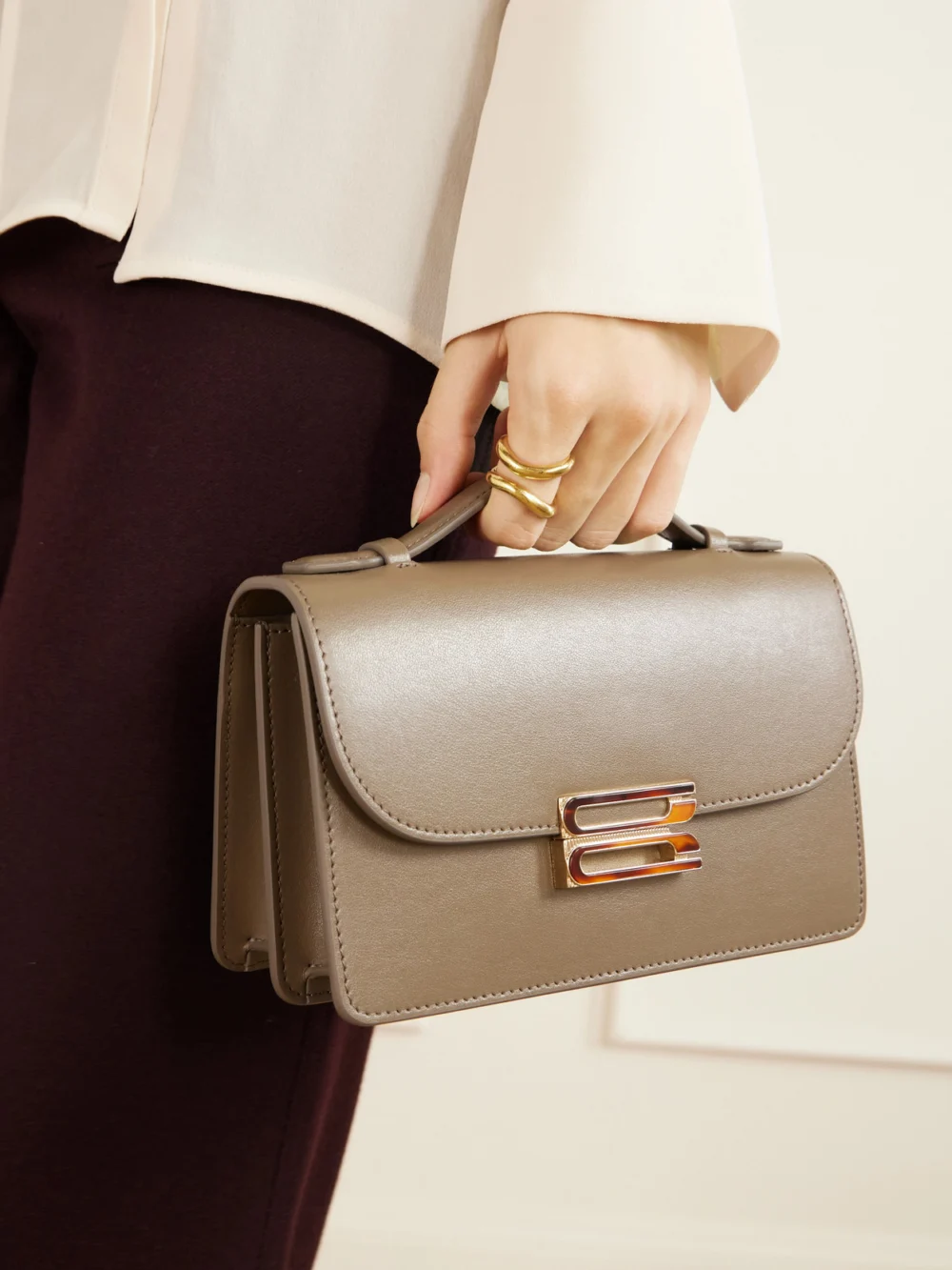 Victoria Beckham Dorian Leather Clutch, styled view