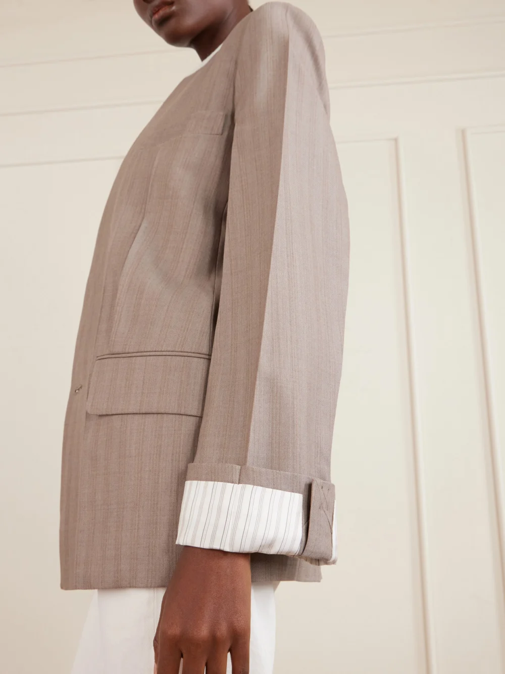 Close-up detail of the Victoria Beckham Double-breasted Striped Wool Blazer