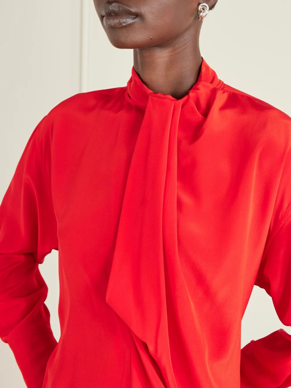 Close-up detail of the Victoria Beckham Draped Silk Blouse