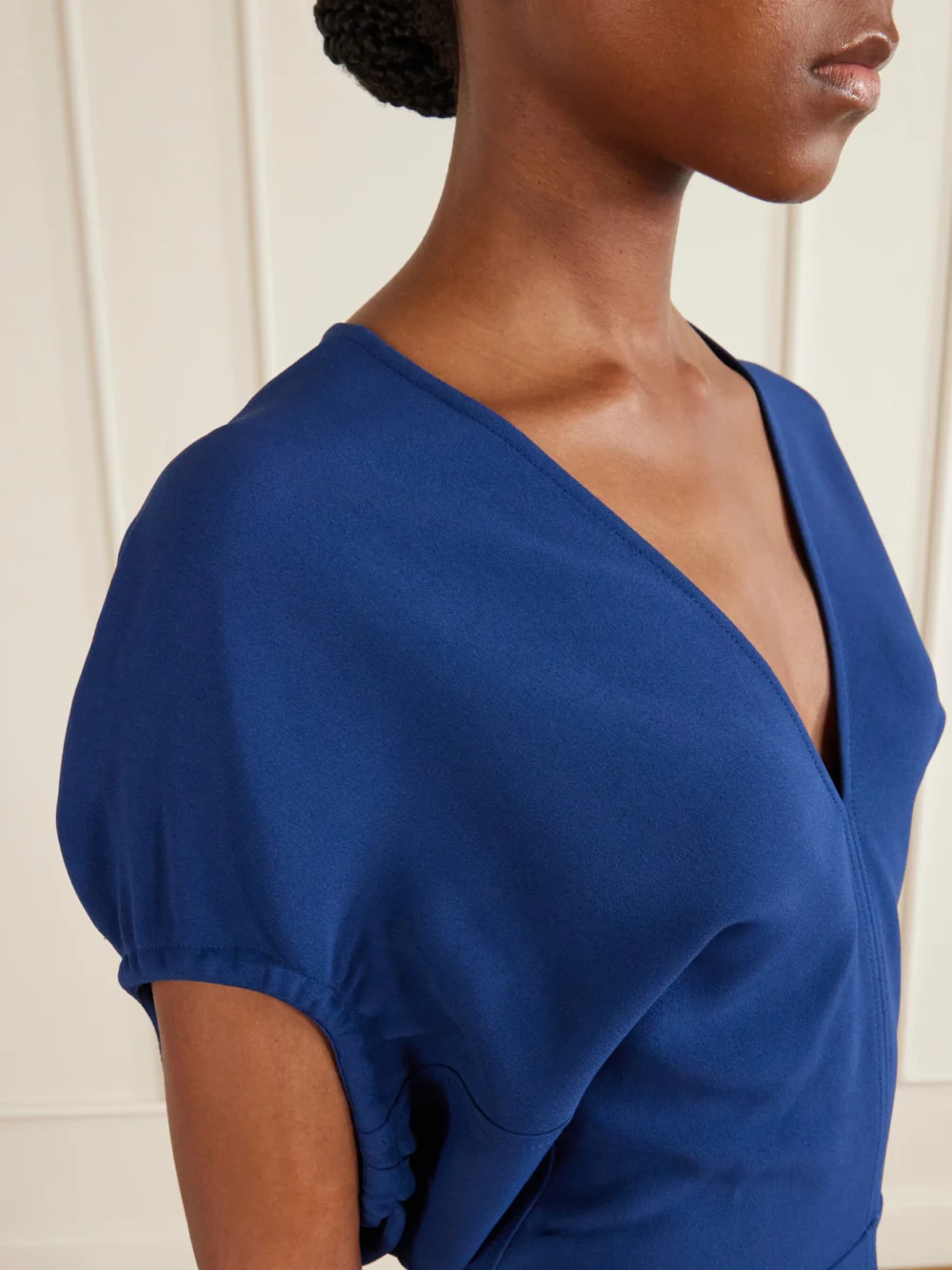 Close-up detail of the Victoria Beckham Edith Crepe Midi Dress