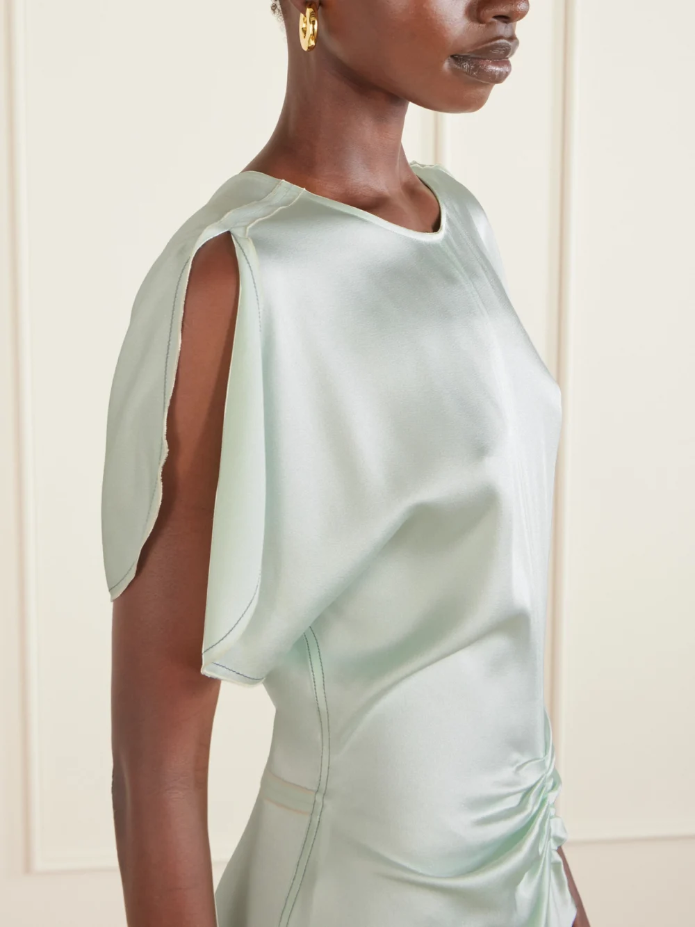 Close-up detail of the Victoria Beckham Gathered Mini Dress