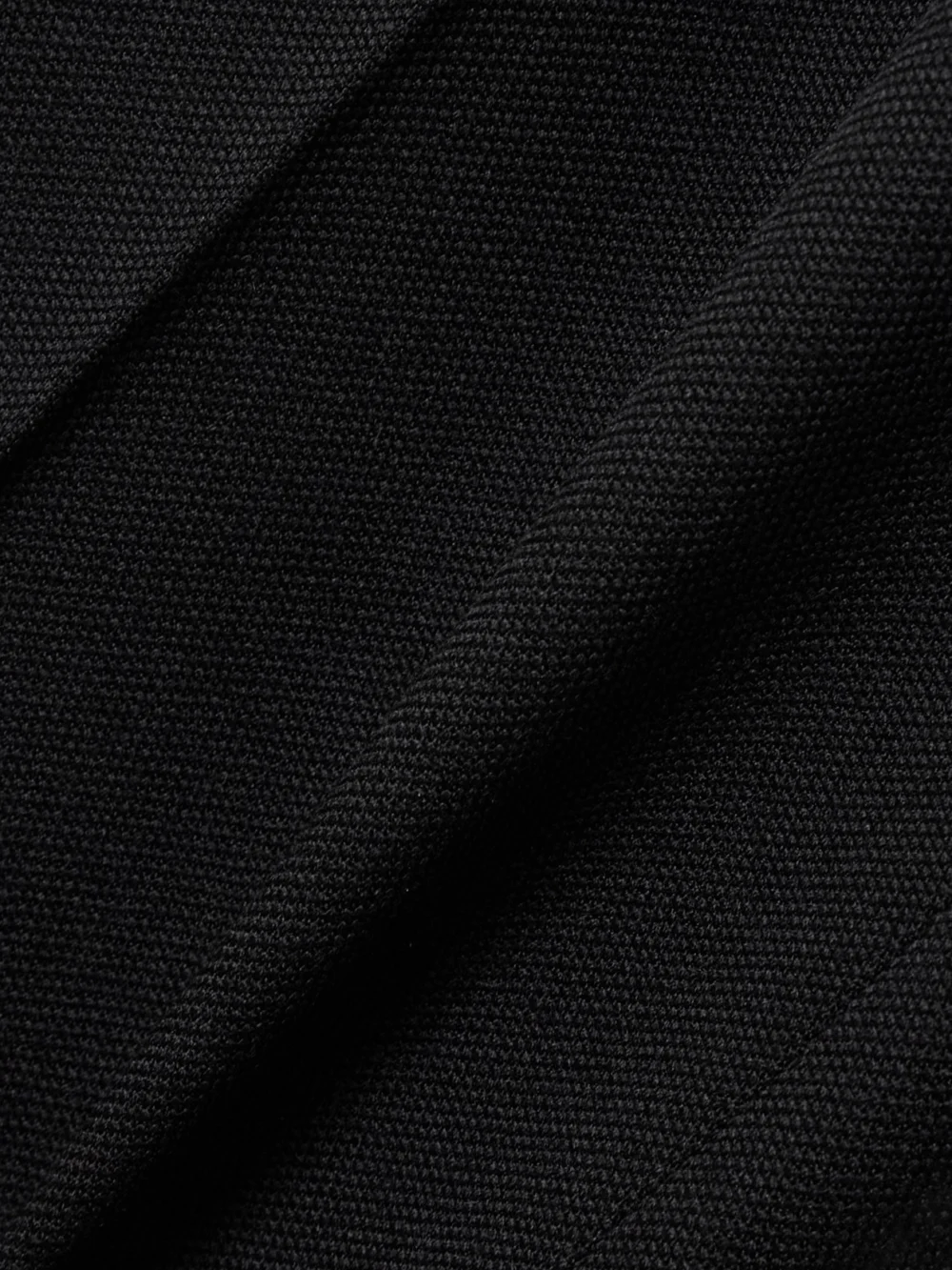 Close-up detail of the Victoria Beckham Grain De Poudre Straight-leg Pants