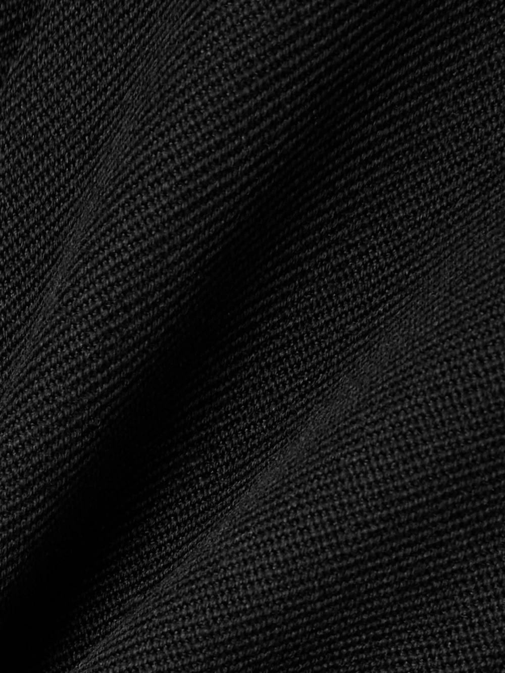 Close-up detail of the Victoria Beckham Grain De Poudre Wool Pleated Wide-leg Pants