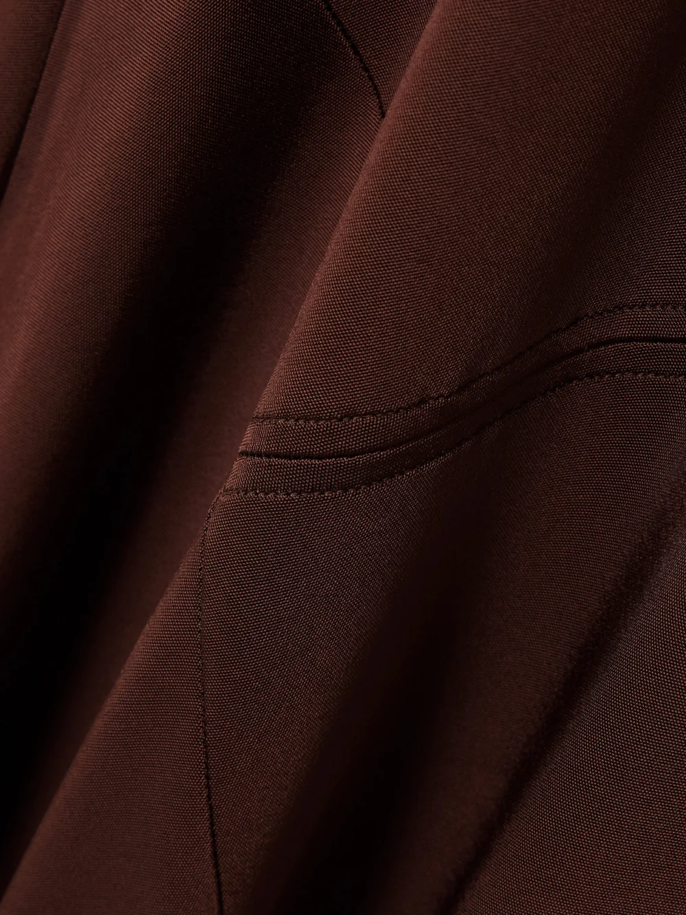 Close-up detail of the Victoria Beckham Hooded Stretch-jersey Midi Dress