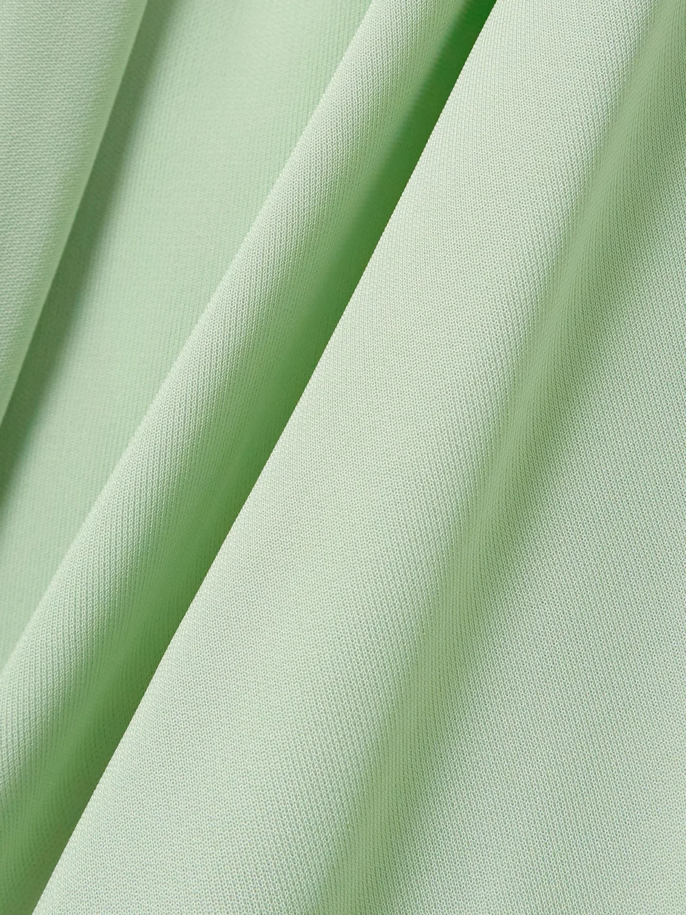 Close-up detail of the Victoria Beckham Knotted Gathered Two-tone Jersey Gown