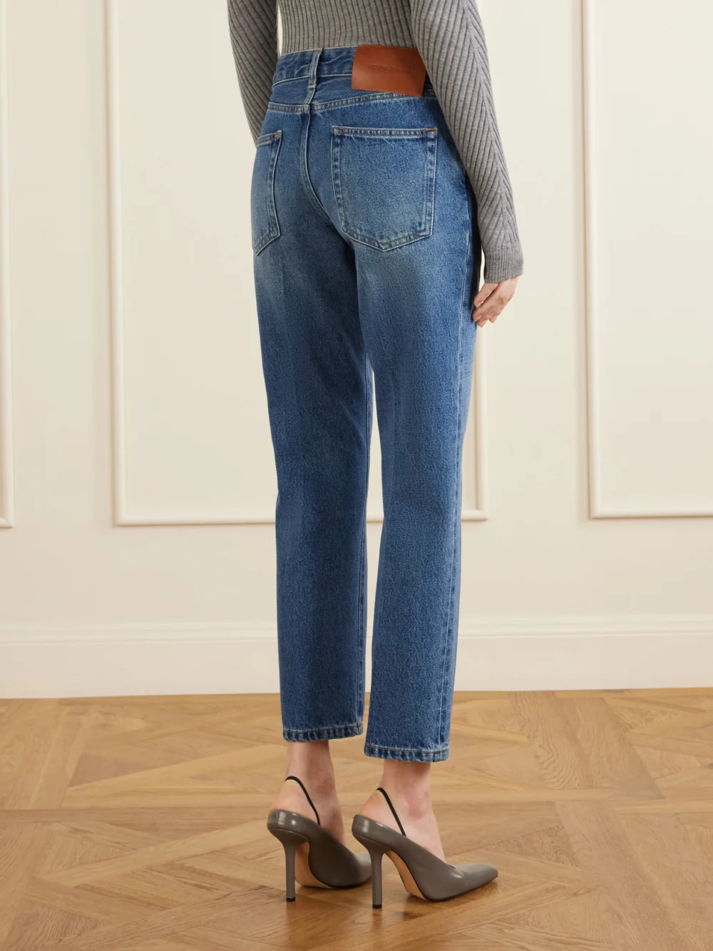 Back view of the Victoria Beckham Leather-trimmed Low-waist Flared Jeans
