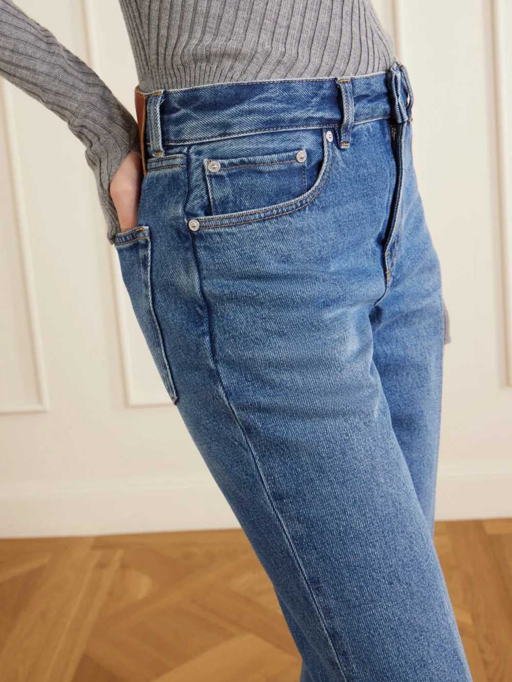 Close-up detail of the Victoria Beckham Leather-trimmed Low-waist Flared Jeans