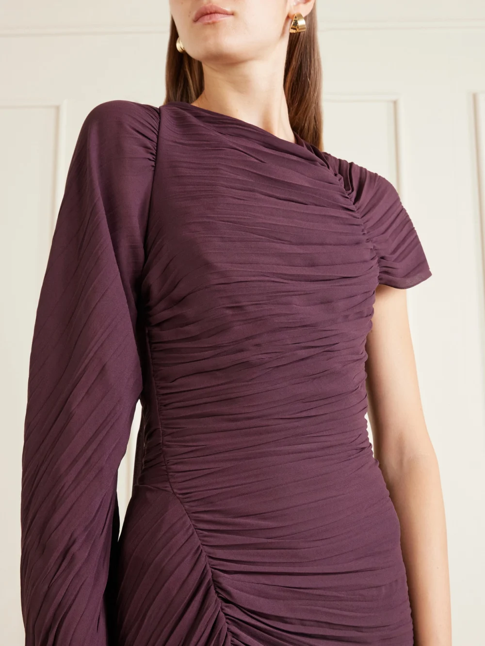 Close-up detail of the Victoria Beckham Off-the-shoulder Plissé Midi Dress