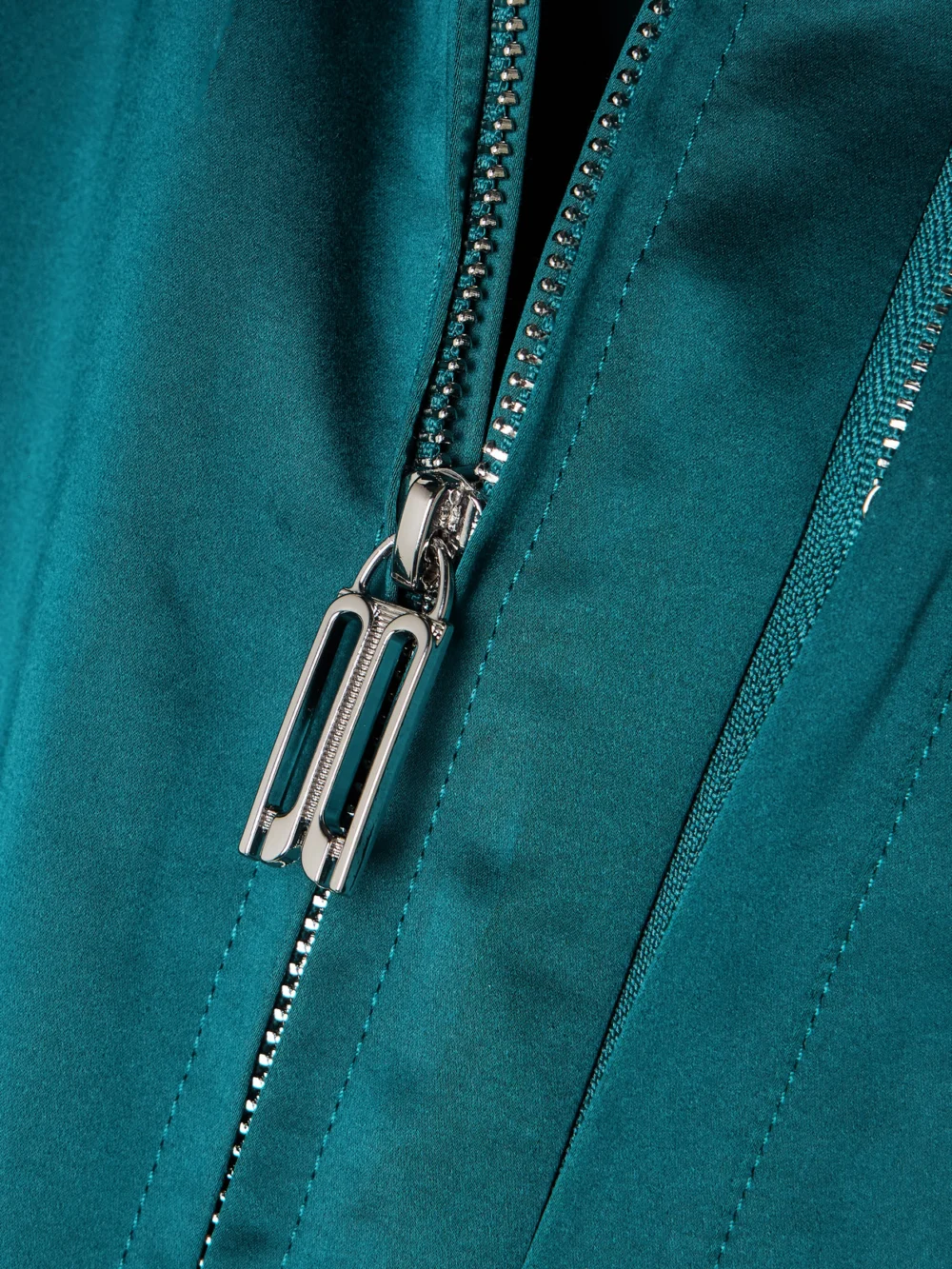 Close-up detail of the Victoria Beckham Padded Cotton-blend Sateen Down Bomber Jacket